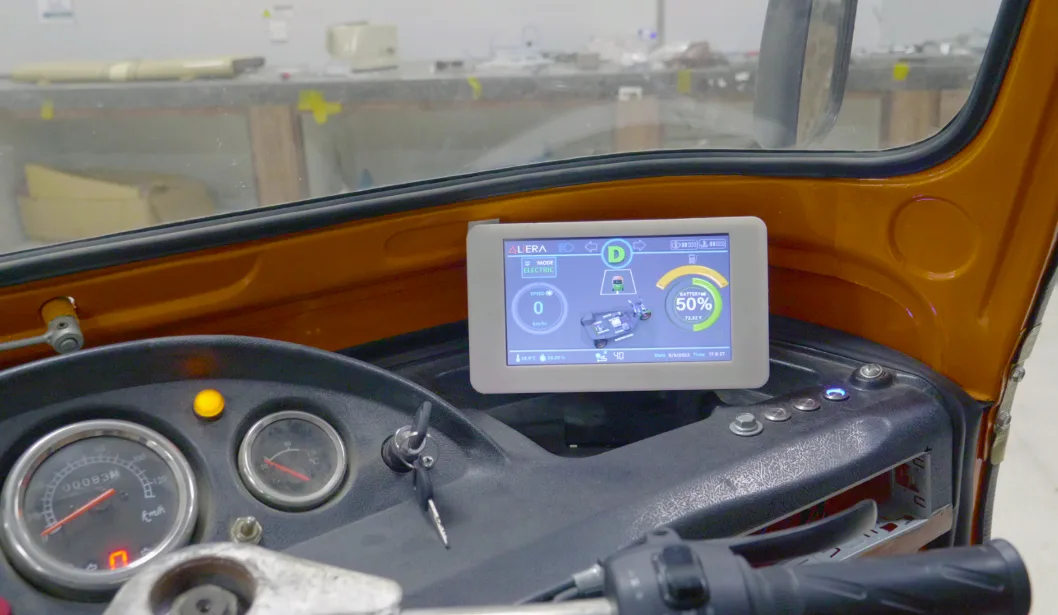 Driver display installed in the cab of a hybrid three-wheeler
