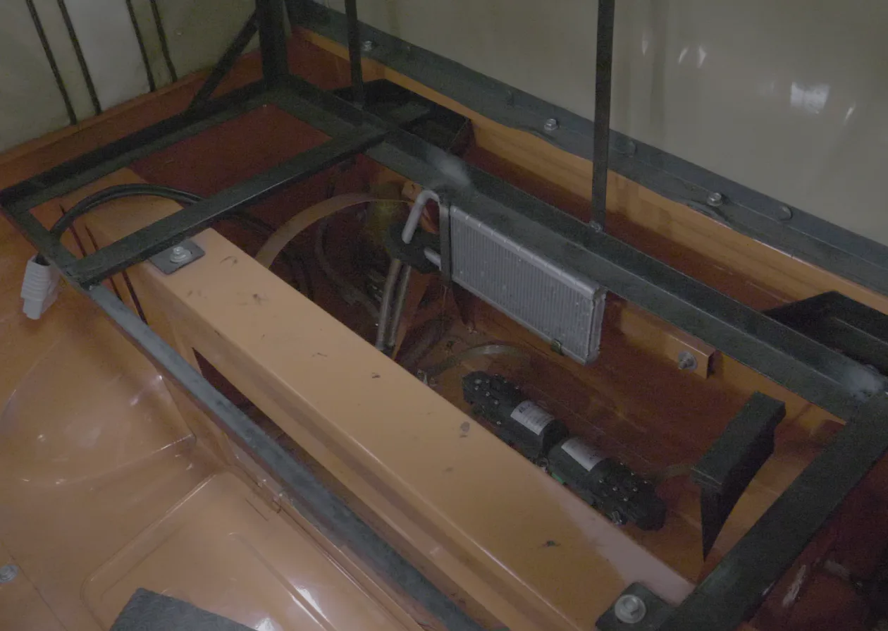 MYPRID powertrain module installed under the floor of a three-wheeler
