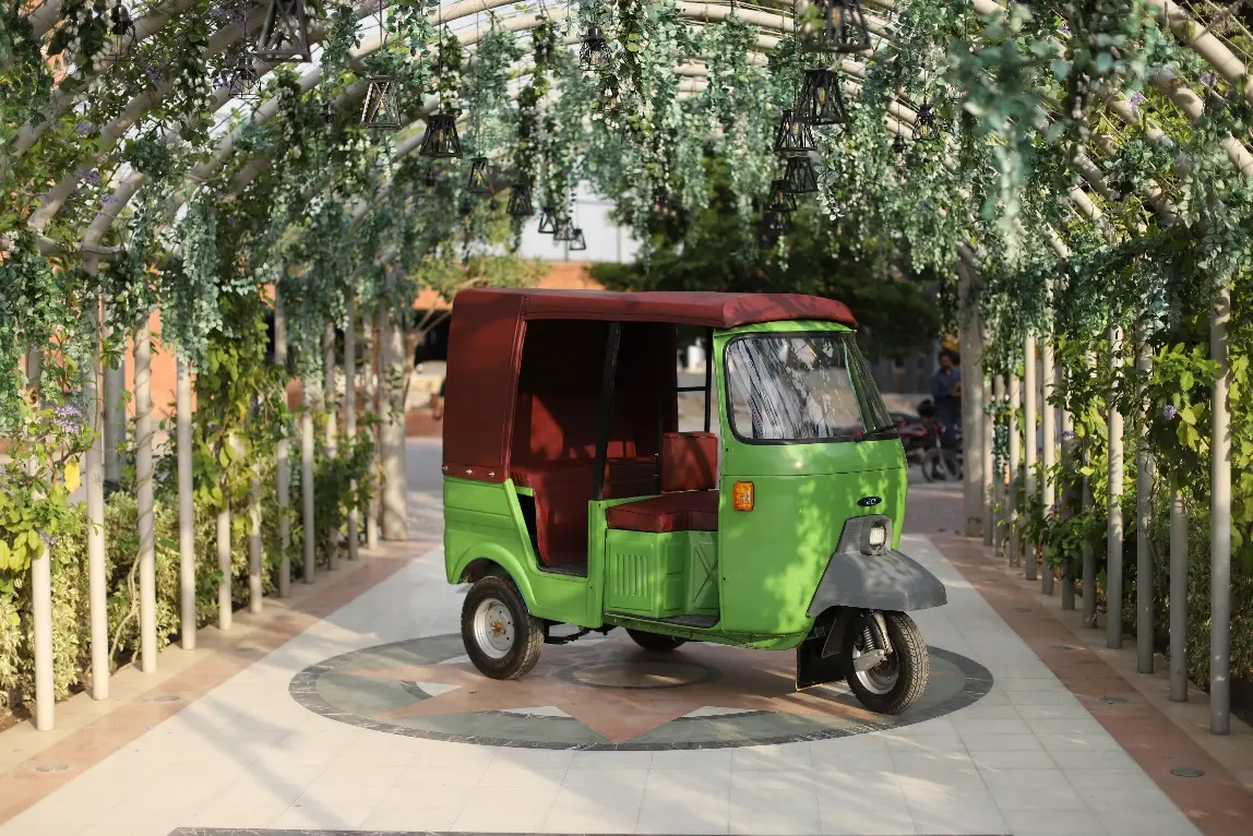 A converted electric three-wheeler rickshaw